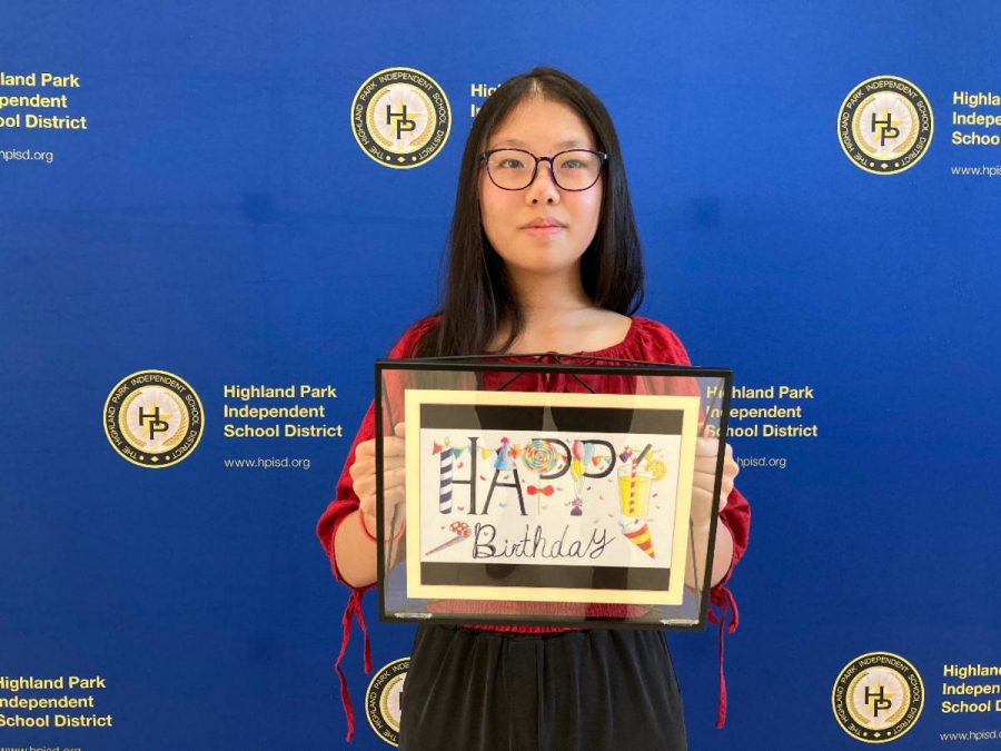 Eighth-grader Yincheng Qian  holds her “Sweet Birthday, which will be on the birthday cards the superintendent sends to all HPISD staff.