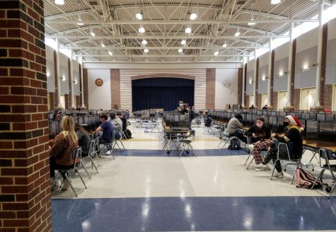 Students sit in the cafeteria after the cohort A fifth period exam. The exam day schedule was made with the intention of minimizing the amount of students in the building at once.