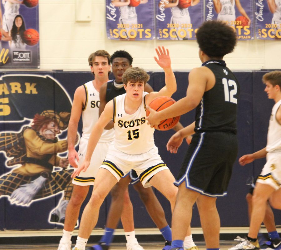 Freshmen Coleson Messer guards a player from North Forney. The opponent attempted to shoot a three-pointer but was blocked by Messer.