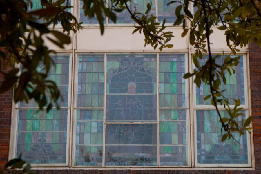 A stained glass window on the side of St. Paul United Methodist Church features a portrait of Jesus Christ. The church was founded in 1873 and is one of the last visible remnants of the Freedmantown community. The City of Dallas registered the building as a landmark in 1982.