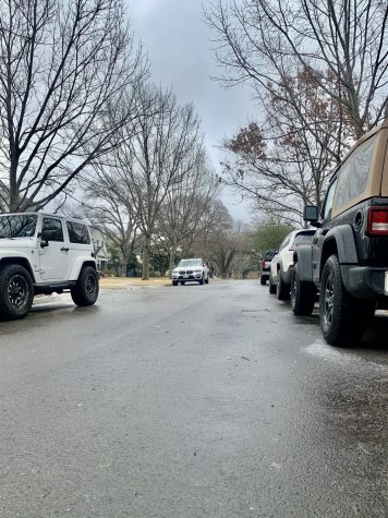 Ice can be seen on the roads under the wheels of the cars as roads are slick and slippery in University Park. Winter weather conditions developed overnight in the DFW area, causing freezing rain. Another cold front is set to blow through Monday.