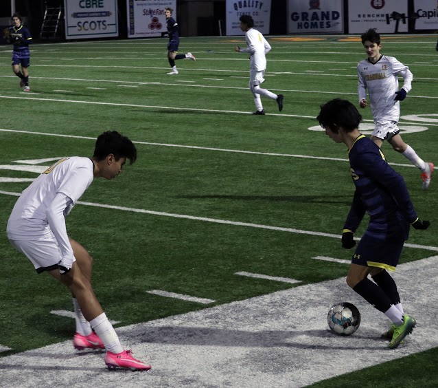 Freshman Elias Taft gains possession of the ball and figures out a strategy to get past Crandall junior Alex Ramirez. This game against Crandall took place on Feb. 9 at 7:15 p.m. and resulted in 4-1 victory. 