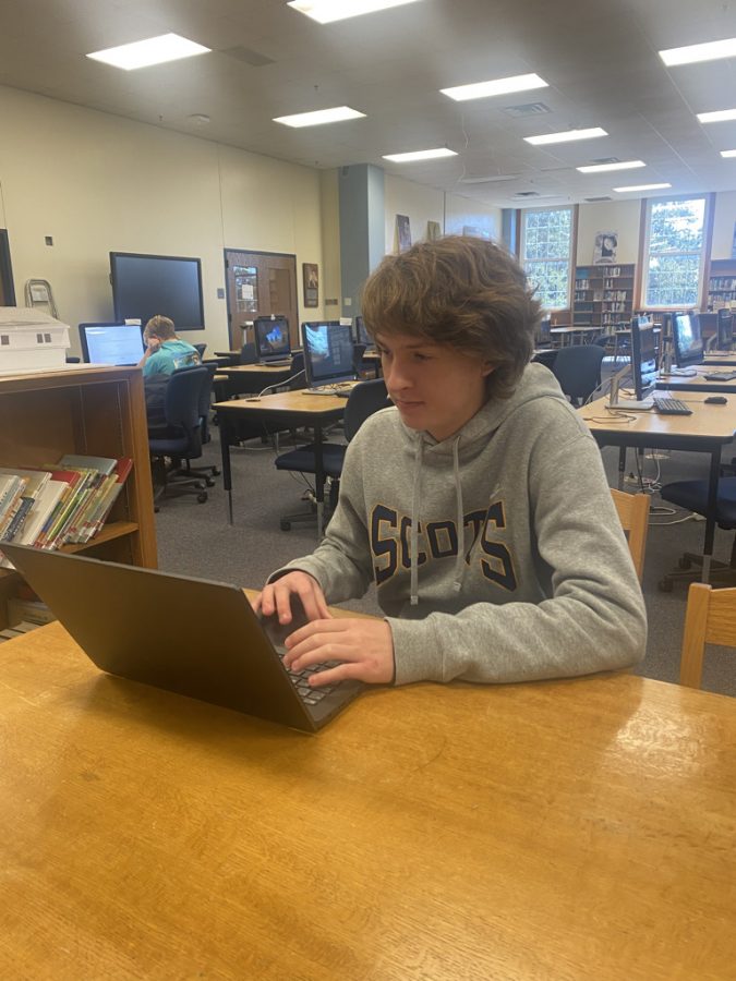 In the library, junior Taylor Judge plays the game Slither during a break. Taylor has played video games since as long as he could remember. I like video games because they give me an outlet to relieve my stress Taylor said. 