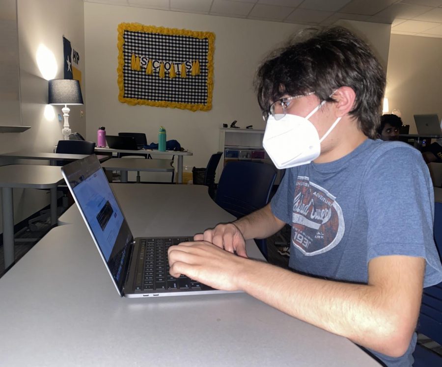 Similar to his usual routine, junior Joseph Maldjian works on his laptop. Maldjian created his own software company.