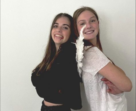 Sophomores Abbey Gross and Caitlin Istre dress up in their trending Halloween costumes. Gross is dressed as an angel and Istre is dressed as a vampire.