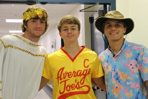 Seniors Blake Beavens, Will Sherwood and Luke Rossley pose for a photo on character day. In anticipation for the dance on Saturday, seniors dress up in costumes according to different themes, which was also decided by STUCO. I dressed as a Hawaii tourist because I thought it would be funny, Rossley said.