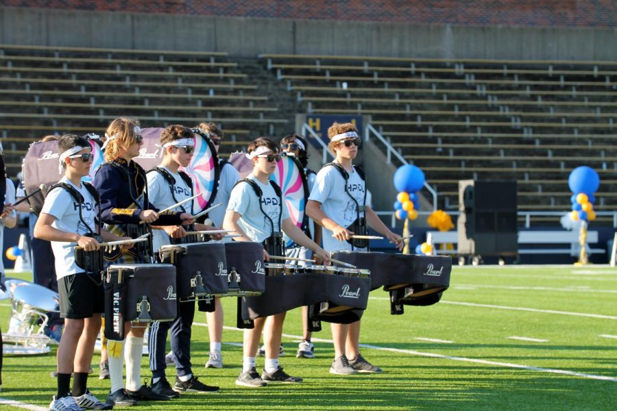 While the pep rally transitions between segments, band drumline members sophomore Dash Whitaker, senior Ford Manley, sophomore Rowan Ryan, senior Gavin Monk and freshman Cam Cason keep the beat. Manleys favorite part of each band performance is when the last note hits. It gives a raw rush of excitement, Manley said.