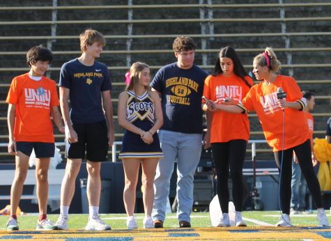 To recognize sophomore Jordan Stribling and juniors Katherine Ann Cochran and Andrew Maroulis as Unity Builders, student council members sophomore Davis Kozman, junior Raina Pietrzak and senior Ava Tiffany address the student body at the homecoming pep rally. While the student council honors two students from each grade level at every pep rally for their Project Respect initiative, this segment also commemorated National Unity Day.
Project Respect is about inclusivity, being kind towards everyone and being the best version of yourself while uplifting your peers, Tiffany said.