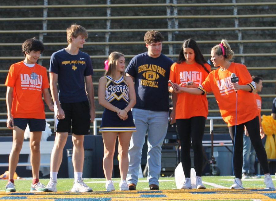 To recognize sophomore Jordan Stribling and juniors Katherine Ann Cochran and Andrew Maroulis as Unity Builders, student council members sophomore Davis Kozman, junior Raina Pietrzak and senior Ava Tiffany address the student body at the homecoming pep rally. While the student council honors two students from each grade level at every pep rally for their Project Respect initiative, this segment also commemorated National Unity Day.
"Project Respect is about inclusivity, being kind towards everyone and being the best version of yourself while uplifting your peers," Tiffany said.