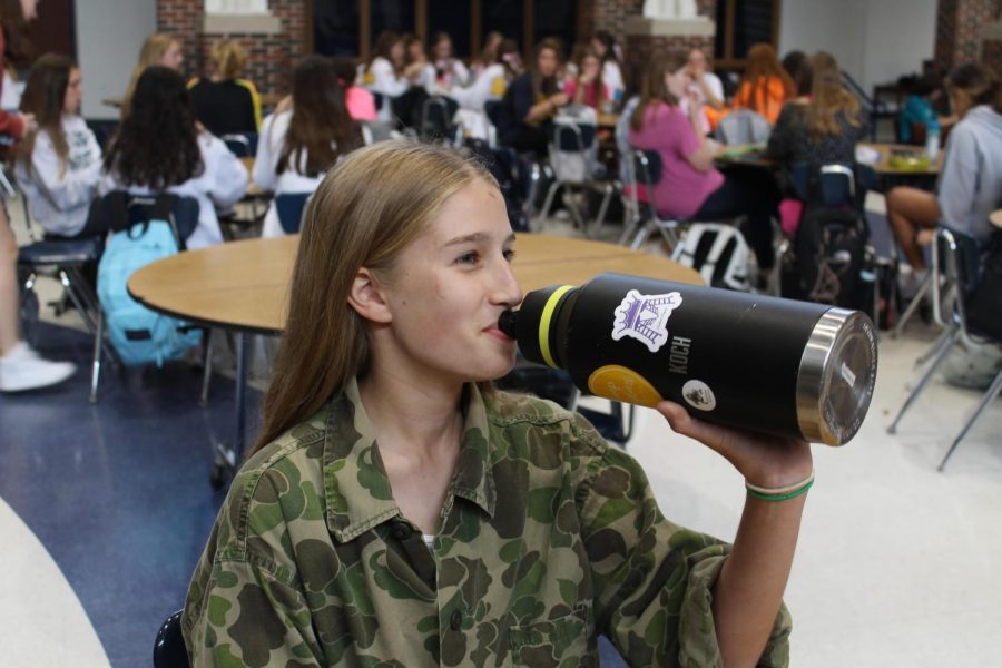 The 52 fluid-ounce water bottle tips as freshman Natalie Koch drinks water at lunch. She had to rehydrate frequently as she participates in marching band. Its crazy to think were running out, she said, on the topic of water conservation.