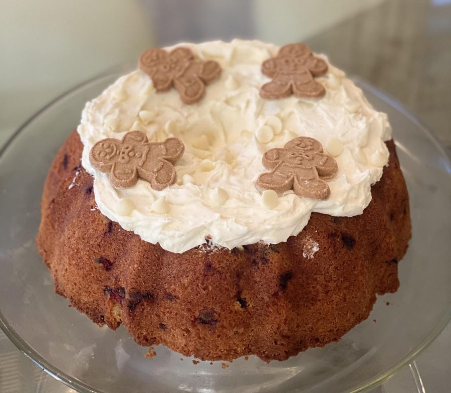 Gingerbread men garnish an orange cranberry bundt cake. The cake looked simple but contained a complex mix of flavors topped with smooth buttercream.