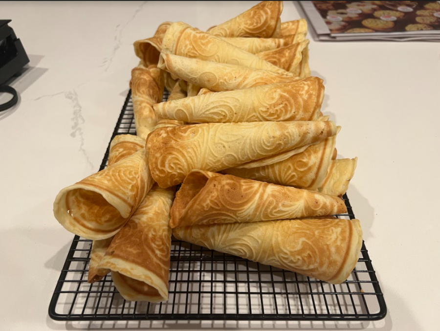 Freshly+baked+Krumkake+cools%2C+waiting+to+be+filled.+The+cookies%2C+which+resemble+waffle+cones%2C+have+a+rich+history+in+Norwegian+holiday+festivities.
