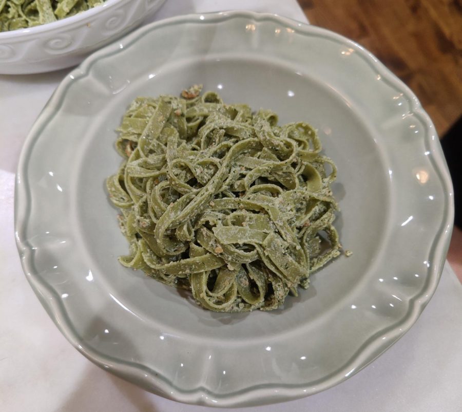 The tagliatelle once it has been plated and topped with the hazelnut pesto. The pasta roots trace back to Liguria, Italy.