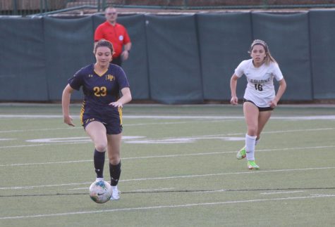 During the game against Cleuburne, midfielder Regan Williams dribbles the ball down the field as opponent Emma Rohr chases after her. The team had a large lead by this point and were close to winning. “This team is built of the hardest working people I know, and their dedication and commitment to soccer is so inspiring,” Williams said.