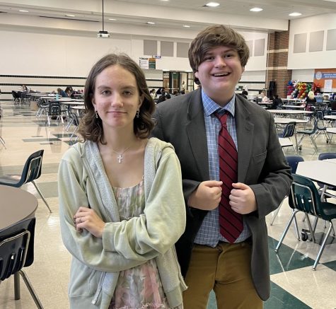 At the Grapevine Classic sophomore Annika Ghai and freshman Camden Coale pose for Coales father. Ghai participated in the original oratory competition. I like debate because it helps you develop relationships and become acquainted with current events, she said. 