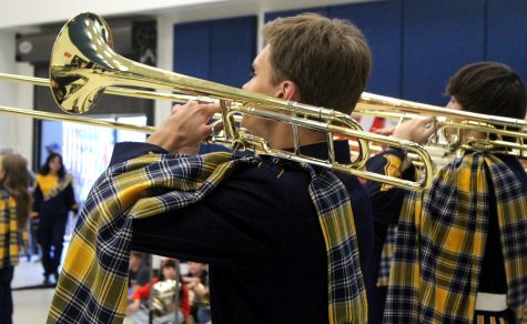 At the start of the BBQ with the Band fundraiser, senior Henry Schieber welcomes guests to the event. The fundraiser was held to raise money for the band and their department. Its always great to get the community involved with band and hopefully spark a new generation of kids to join, Schieber said.