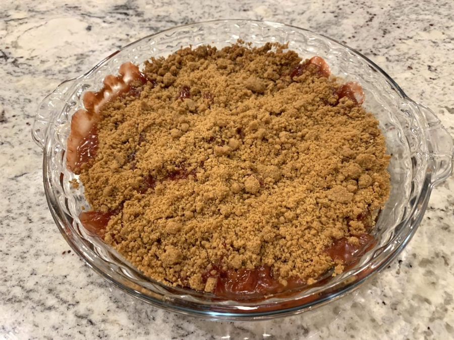 The crumble after it has been cooked and is ready to be eaten. The crumble tastes best when it is topped with vanilla ice cream.