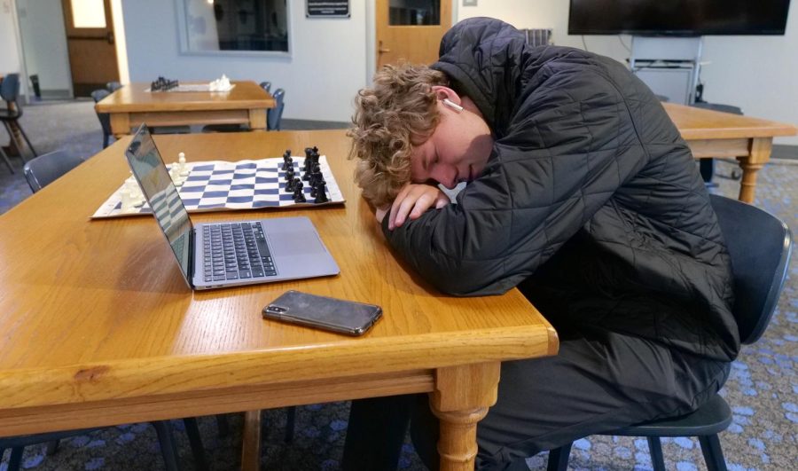 Senior Flynn Hatch takes a nap in front of his computer in the library. Sleep is one of the most important factors in adolescent development, but can be compromised by technology use. "I'd say school impacts my ability to sleep because I spend so much time in activities outside of school and that leaves no time for homework or family time, and compromises my sleep schedule," Hatch said. 