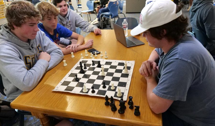 Sophomores Cameron Cason, Marshall Haggar, Will Signor and Braxton Giffin play chess in the library. The library has several chess boards where students can often be found playing the game. I love chess because of all the interesting intricacies of it, its such a fun game, Carson said. 