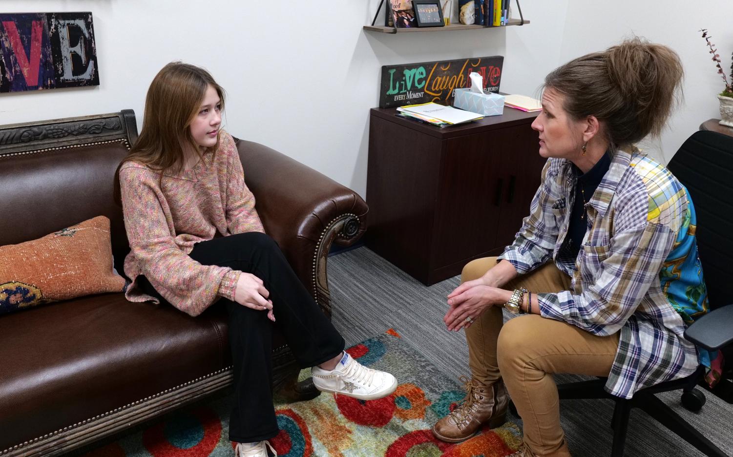 In the counseling office, sophomore Tatum Connor meets with counselor Stacey McNeely. Both students and educators have emphasized that attending therapy or counseling sessions is not something to be ashamed of. If I can help a student have an easier time in high school and help them prepare for their future, then it would bring me a lot of joy, McNeely said. 