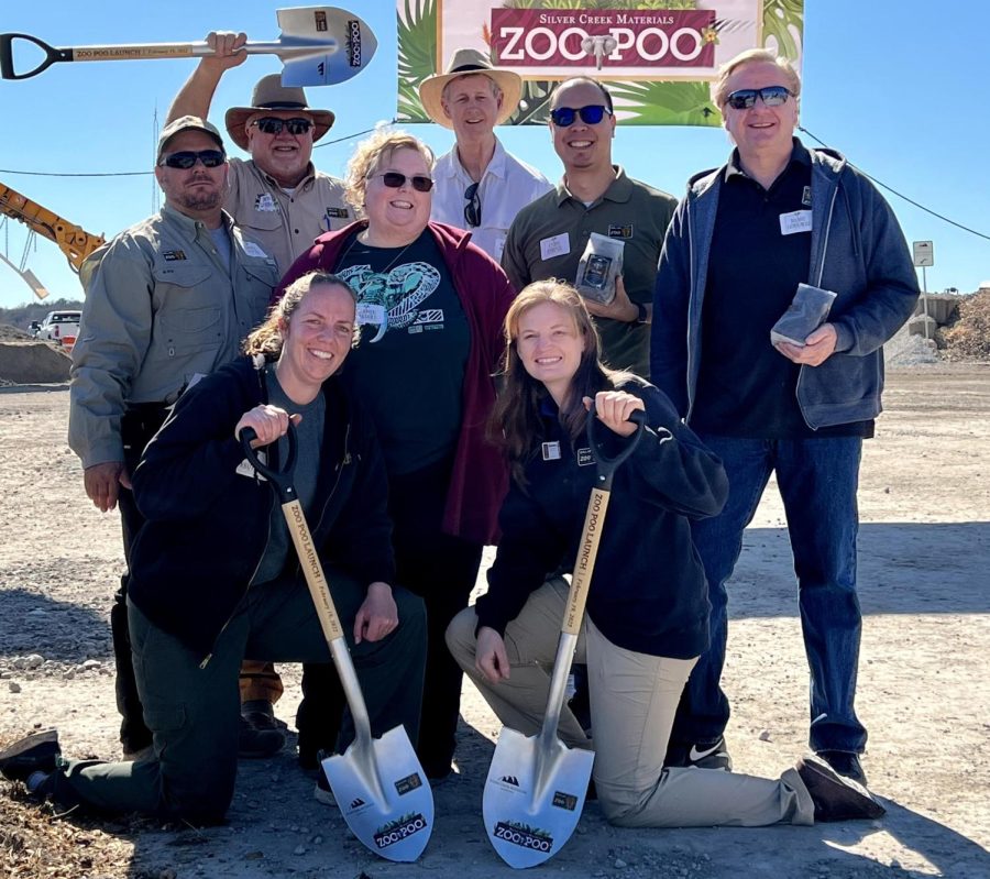 The Dallas Zoo Sustainability Steering Committee poses in front of "Zoo Poo" sign to commemorate their movements towards sustainability. The team posed at Silver Creek Materials where they celebrated the launch of the program.