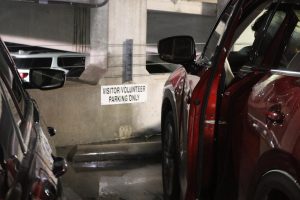 Senior Matteo Winandy pulls into a visitor parking space in the parking garage. When there is someone parked in your designated spot, seniors and juniors are expected to report the violation and park in visitors for the day. 