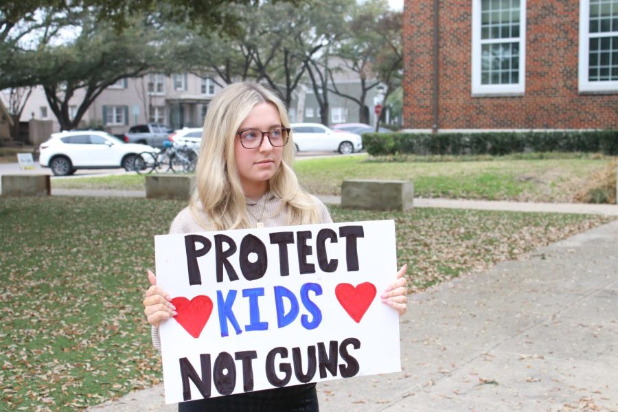 Senior Tori Acquista holds a sign in favor of stricter gun laws. About 70% of young Americans are in favor of stricter gun laws according to the Harvard Institute of Politics. I believe our country can reduce gun violence by creating stricter gun laws on the sale of fire arms like requiring background checks, Acquista said. 