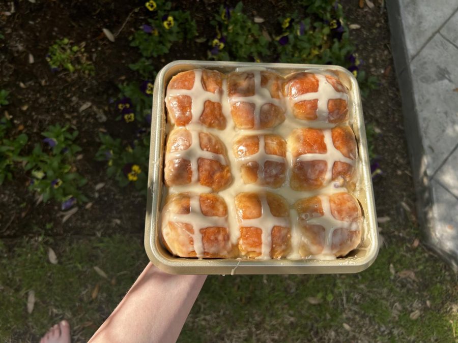 The hot cross buns when they've been baked to a golden color and topped with a glaze. The buns are traditionally made for Easter, but can be eaten at any time. 