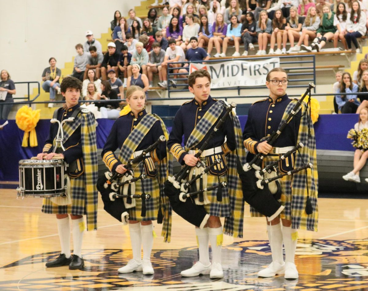 Bagpipers Sam Masullo, Natalie Koch, Jake Wood and Gage Swords were recognized by head coach Randy Allen. Were always happy to be there for the community, junior Natalie Koch said. The bagpipes have been such a significant symbol in our school, and being able to carry on the tradition in the future years is a true honor. 