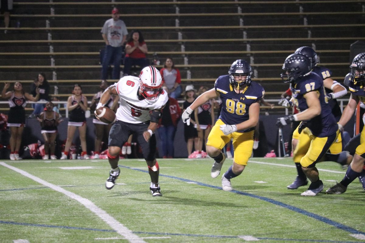 At the homecoming game, the Scots fended off the MacArthur Cardinals, keeping the opposition from scoring until the fourth quarter. 