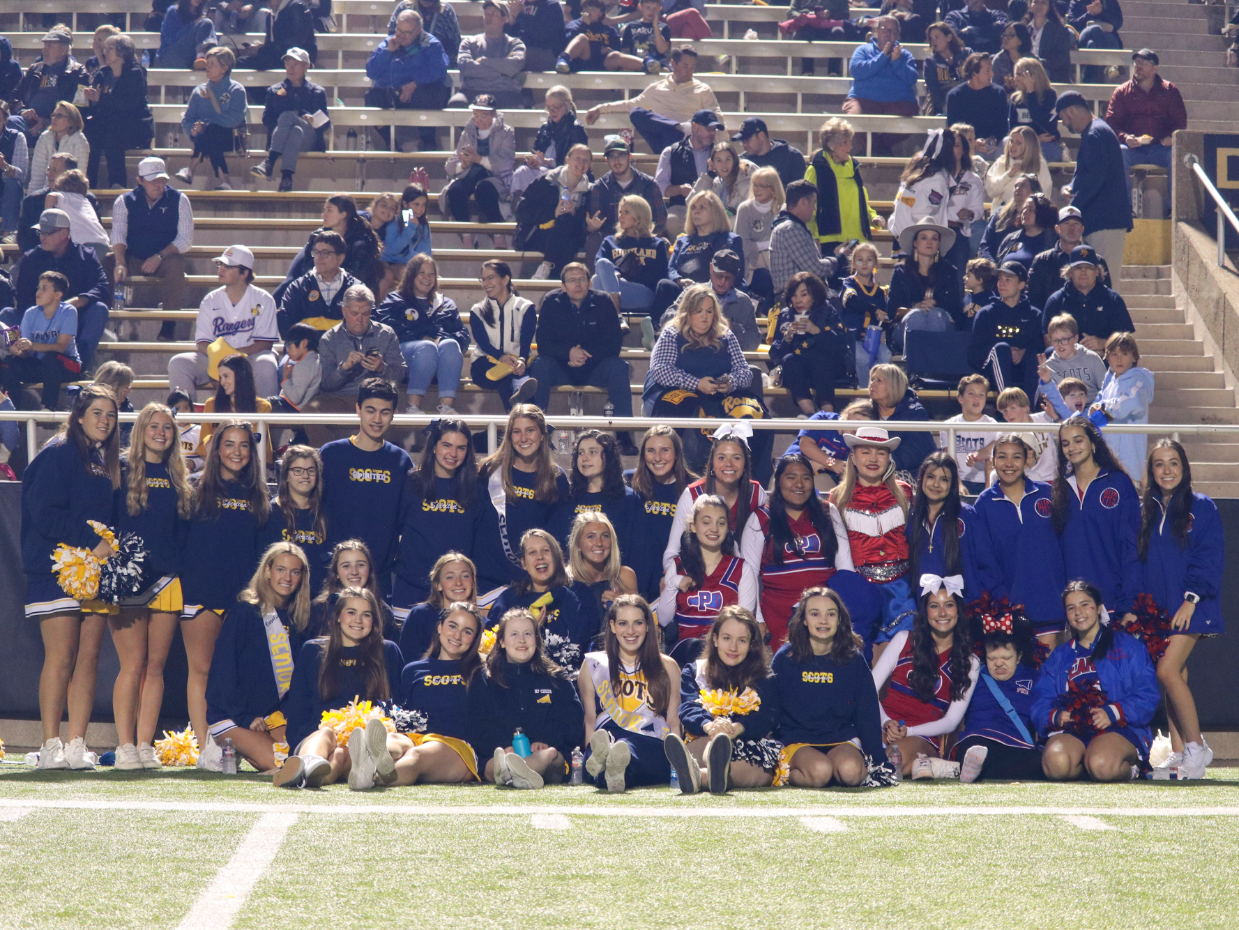 The Spirited Scots and J. J. Pearce cheer squad pose at last regular season home game. 